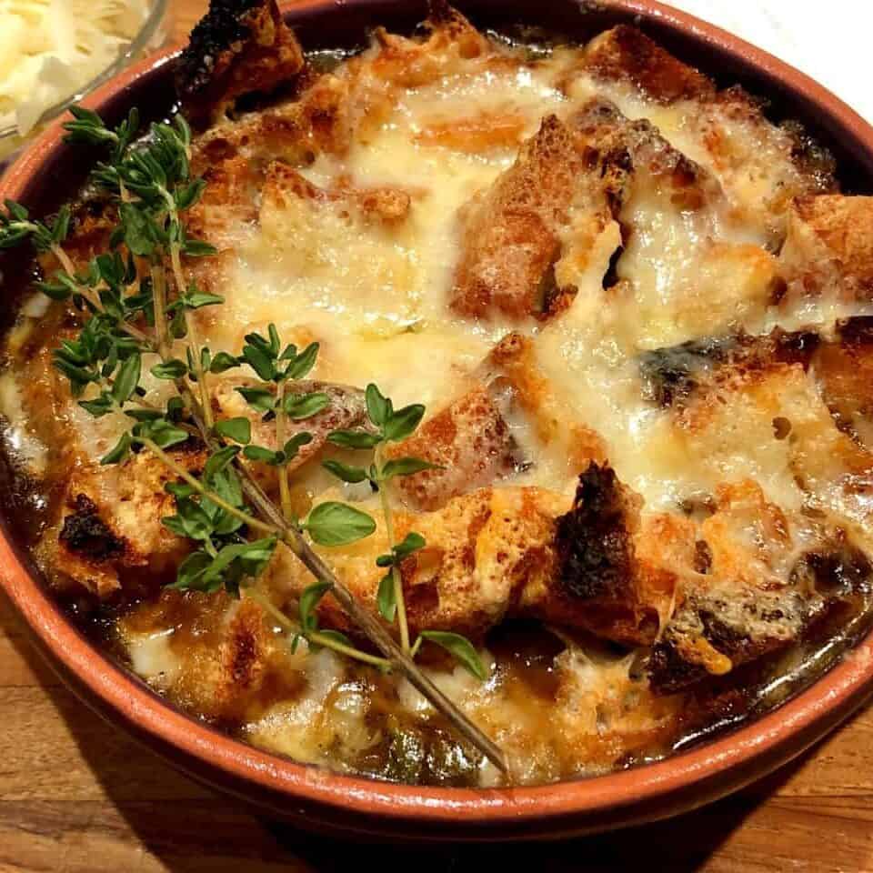 Delicious baked French onion dish with melted cheese and herbs.